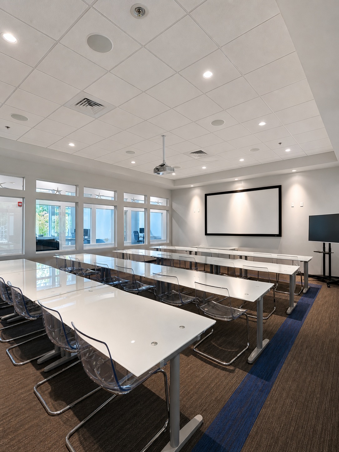 Presentation & Event Room set in classroom rows with a projection screen at 1150 Sagamore Avenue, Portsmouth NH